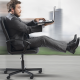 Businessman in office chair racing down a racetrack business growth